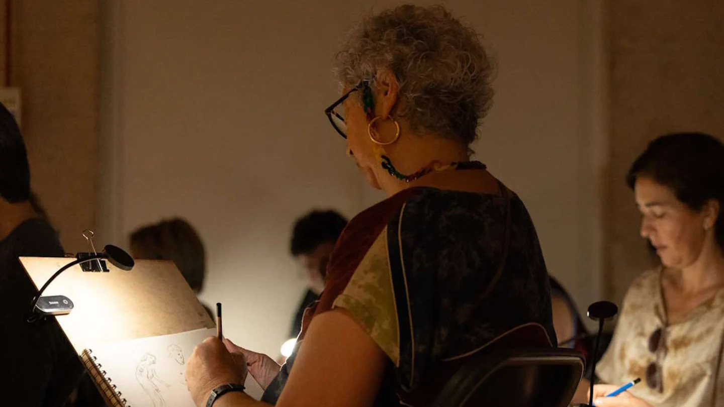 Participants sketching in notebooks during a Gulbenkian museum drawing activity