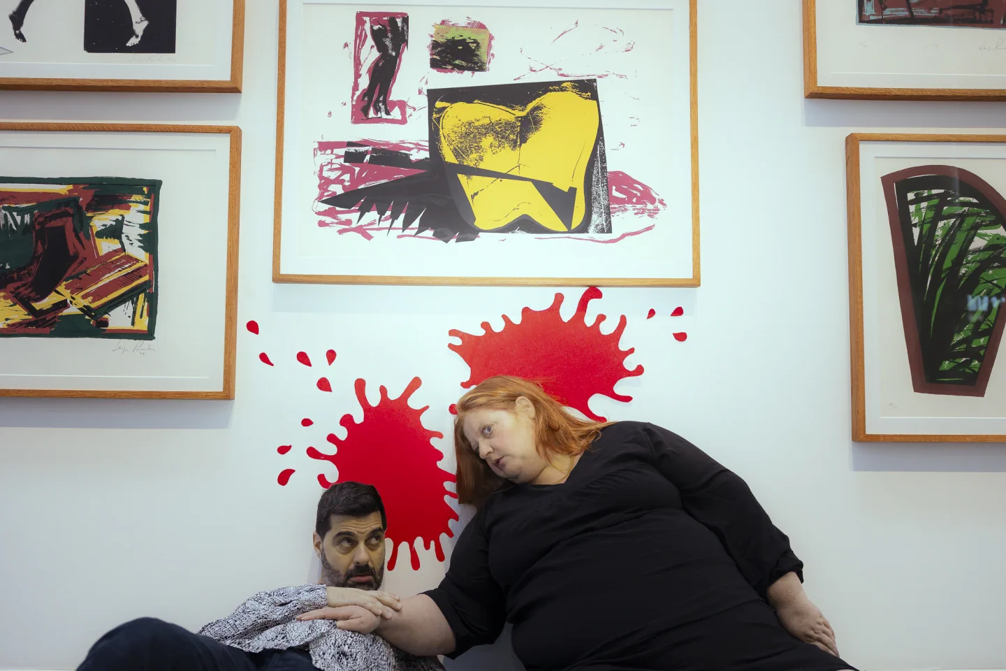 Teatro Praga performers beside framed artworks in MAAT’s creative-workshop publicity photo