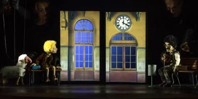 Puppet characters on a railway-station stage in Next Station’s official publicity photo