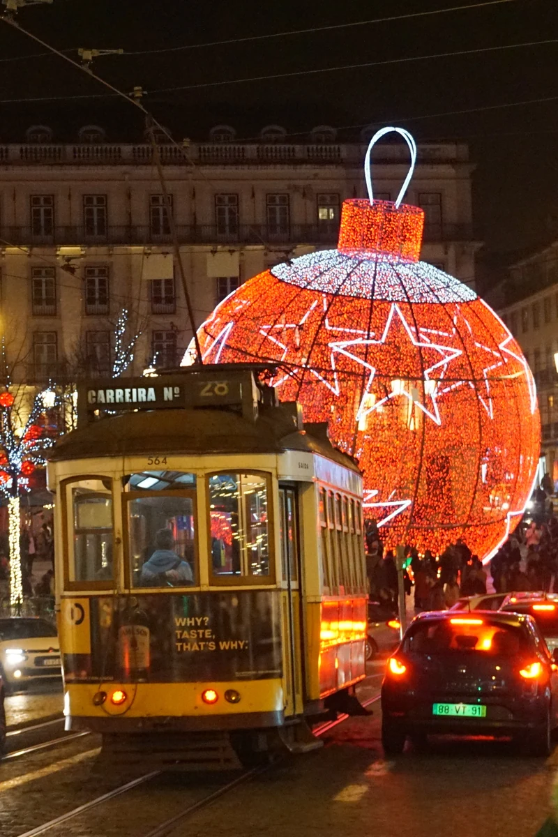 A Lisbon tram beneath Christmas decorations in Chiado in December 2019