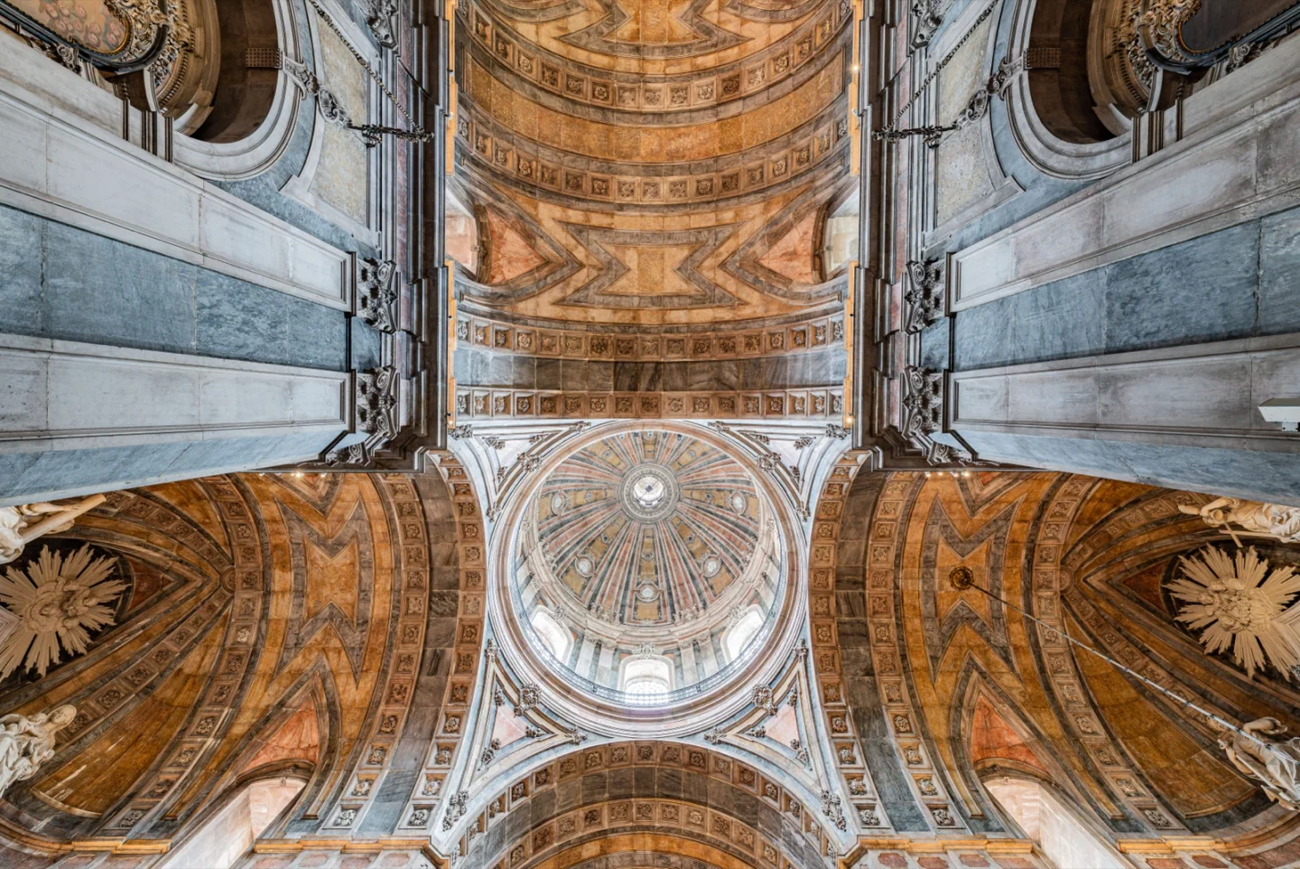 The ornate dome and vaulted ceiling inside Lisbon’s Basílica da Estrela.