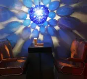 The blue light fixture and colourful seating inside PUREX
