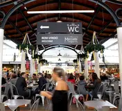 The covered food hall and central tables of Mercado de Campo de Ourique