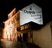 The Chapitô building on Costa do Castelo illuminated at night