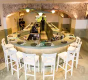 The curved dining counter and vaulted ceiling at Peixola
