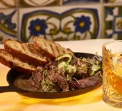 A dish and drink in Mama Shelter Lisboa’s official restaurant gallery