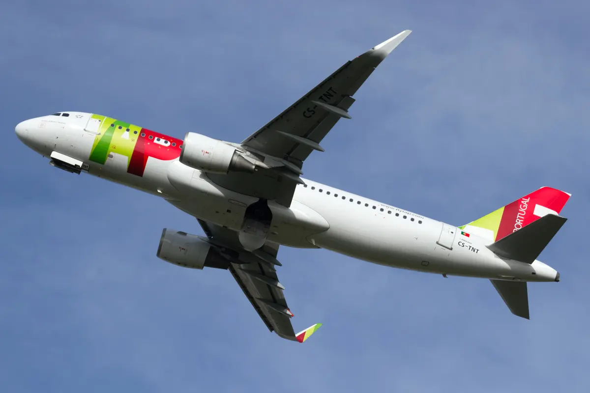 A TAP Airbus A320 taking off at Lisbon airport