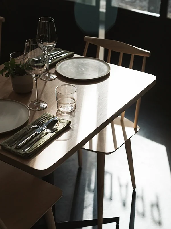 Sunlight falling across a dining table at Prado