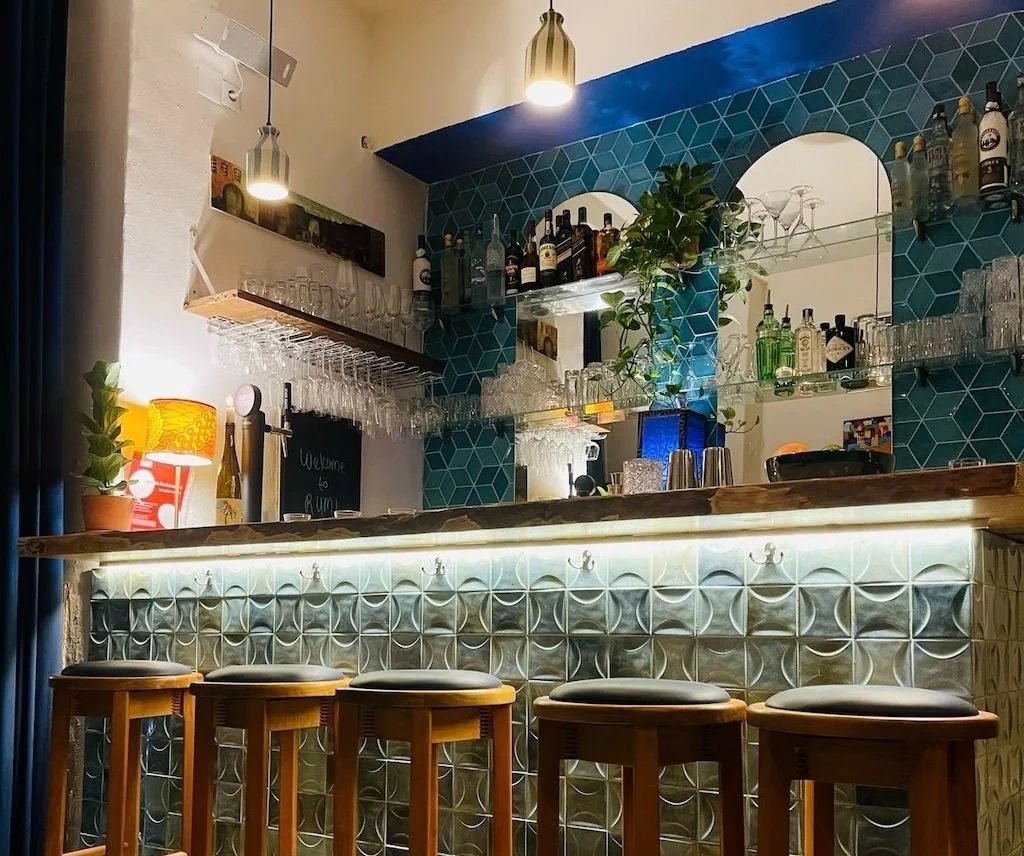 The tiled bar and dining space inside RUMI Lisboa