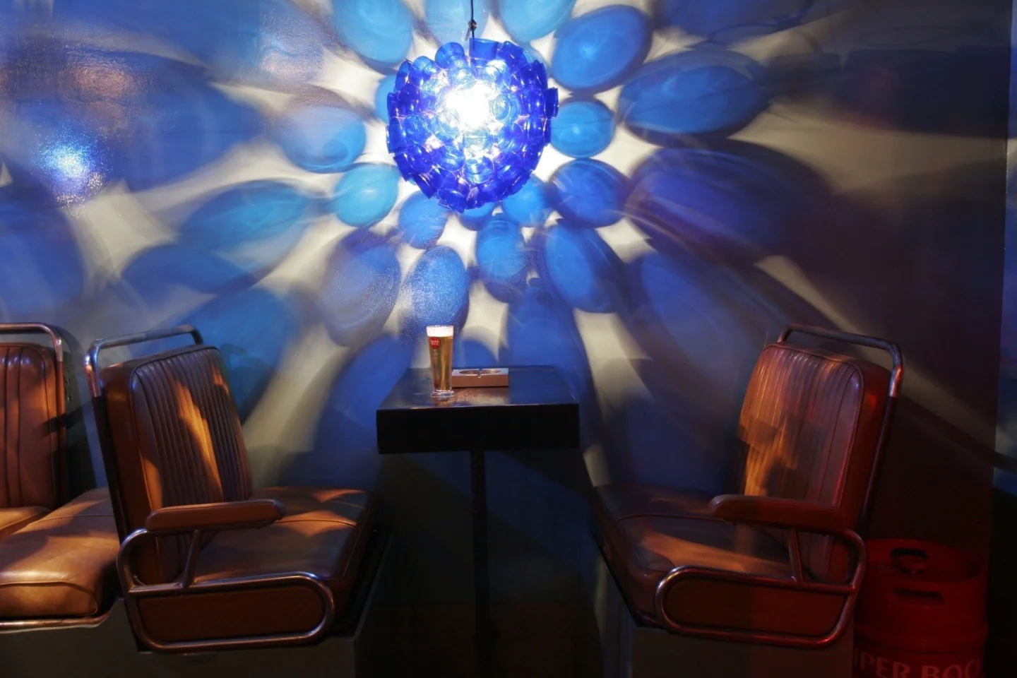The blue light fixture and colourful seating inside PUREX
