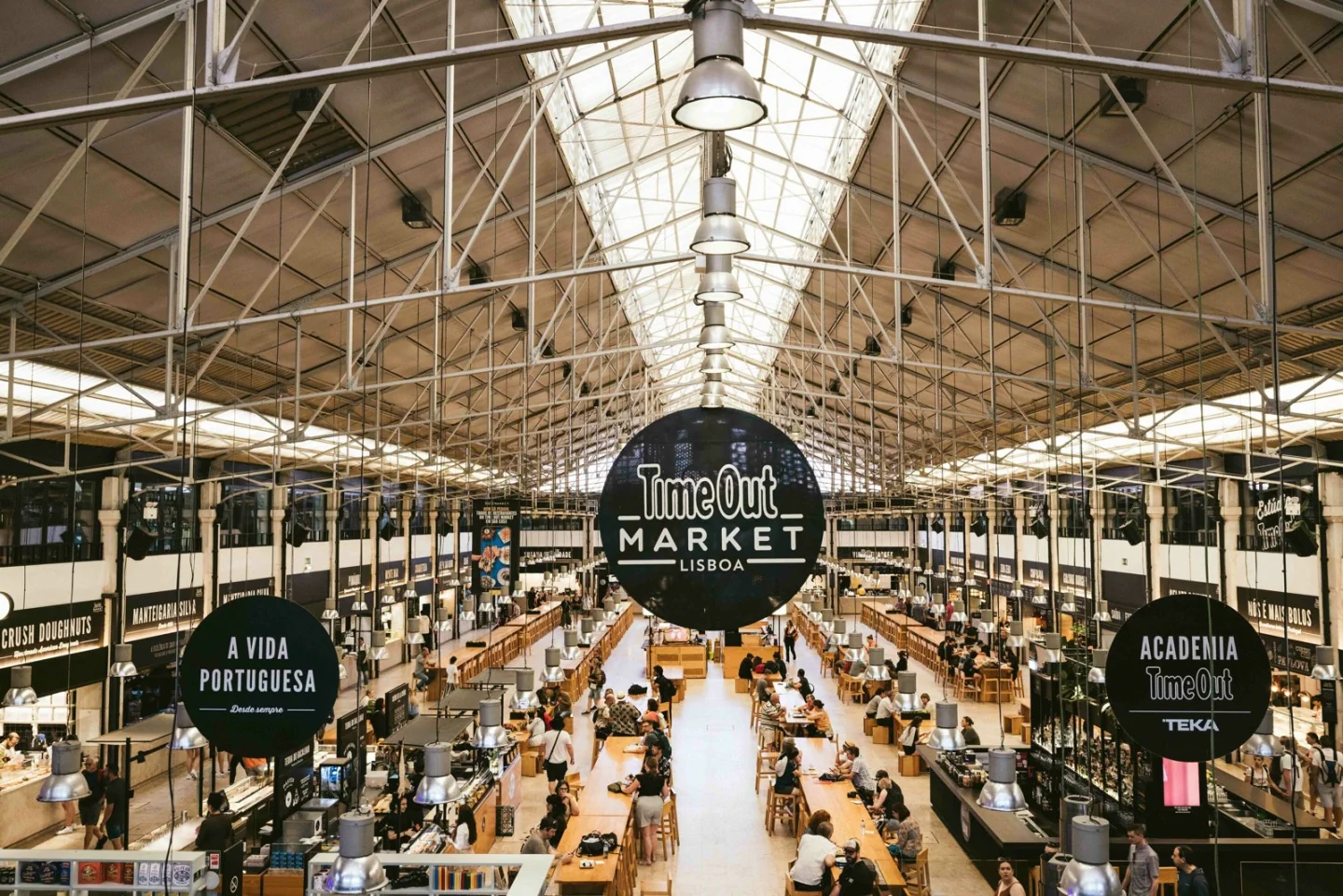The food hall and long communal tables inside Time Out Market Lisboa