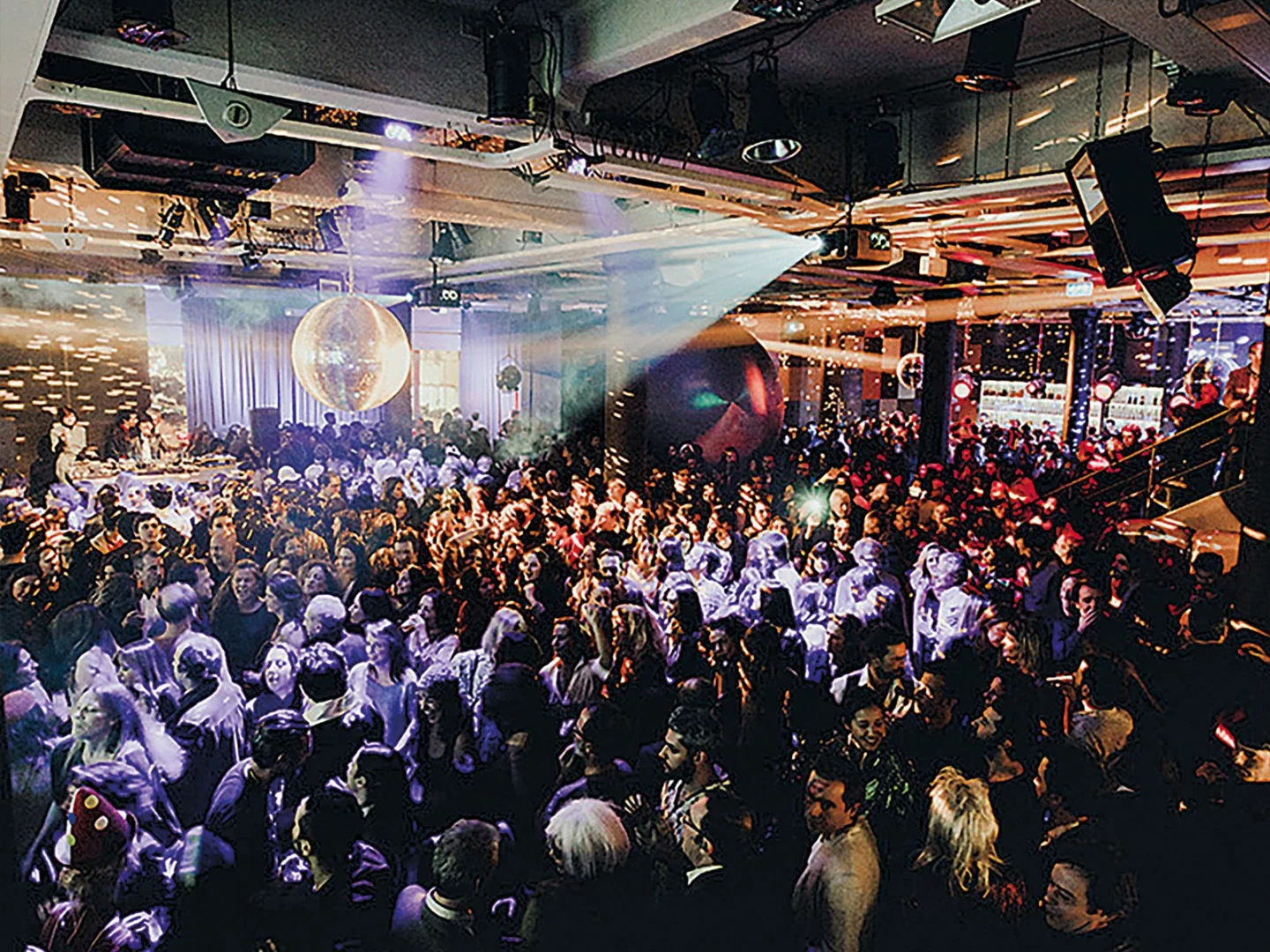 The crowd and DJ area inside Lux Frágil