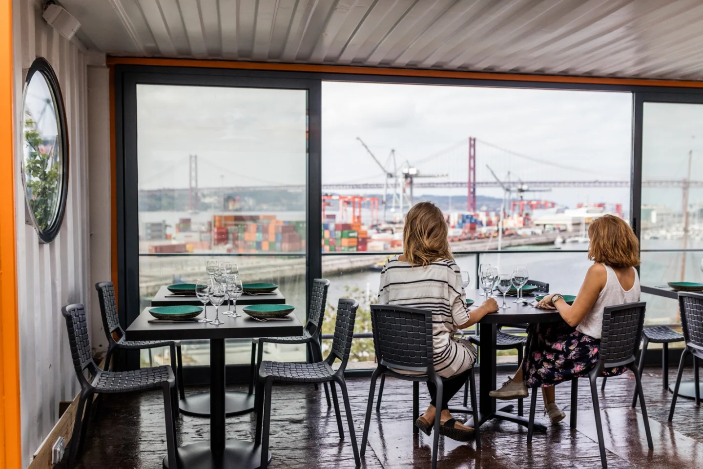 A table beside the large windows and river view at OKAH