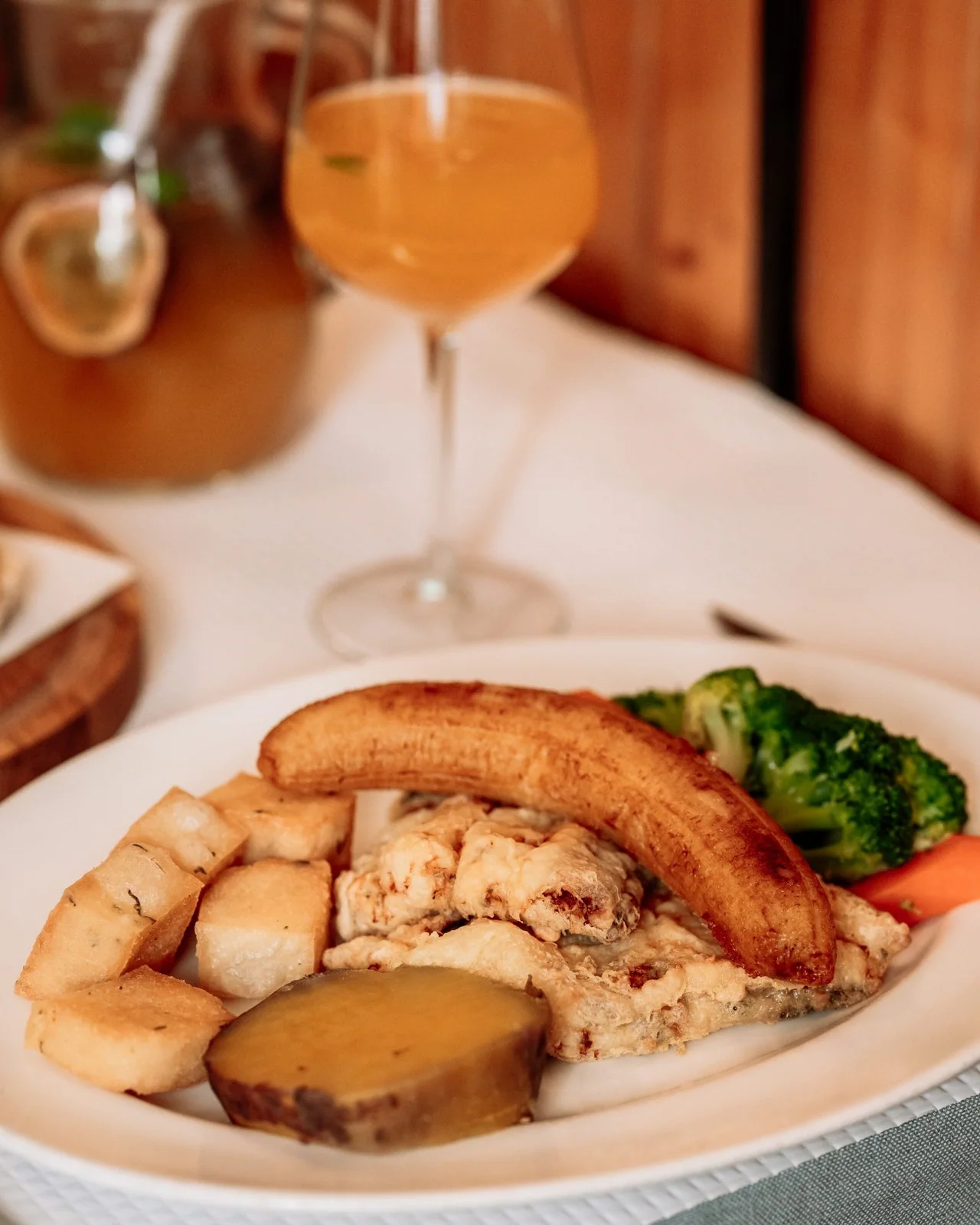 A plated dish and wine in Ilha da Madeira’s official gallery