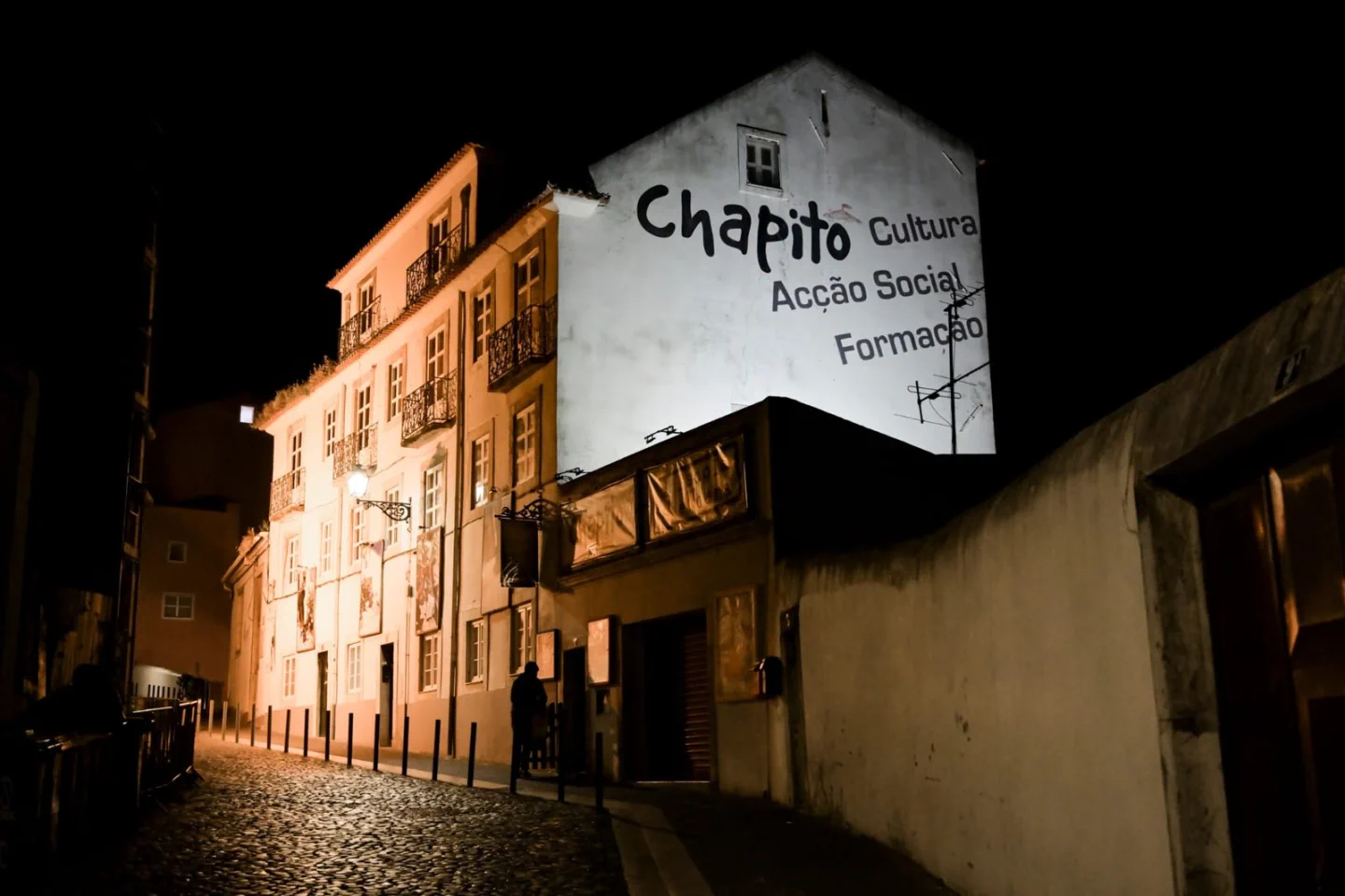 The Chapitô building on Costa do Castelo illuminated at night