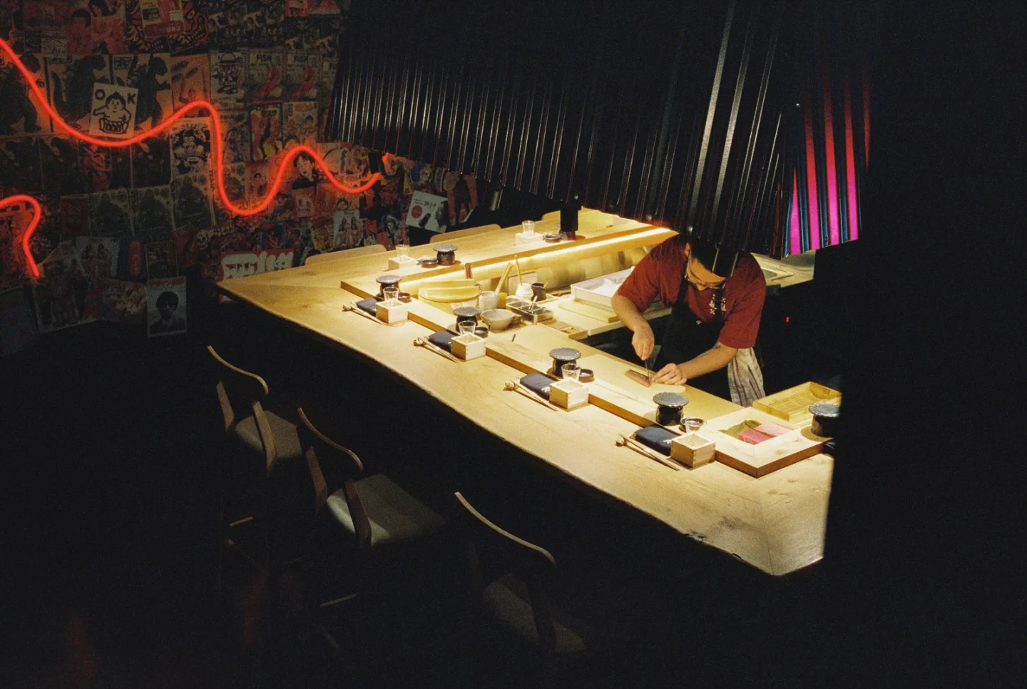The small sushi counter and place settings inside Omakase Ri