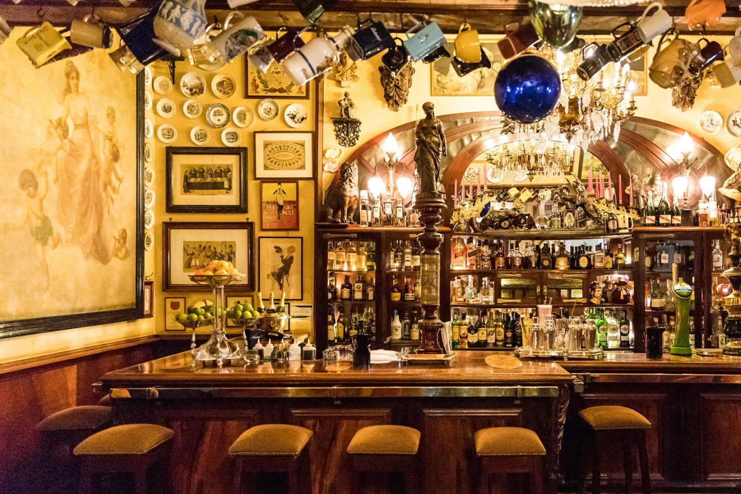 The densely decorated bar and display cabinets at Pavilhão Chinês
