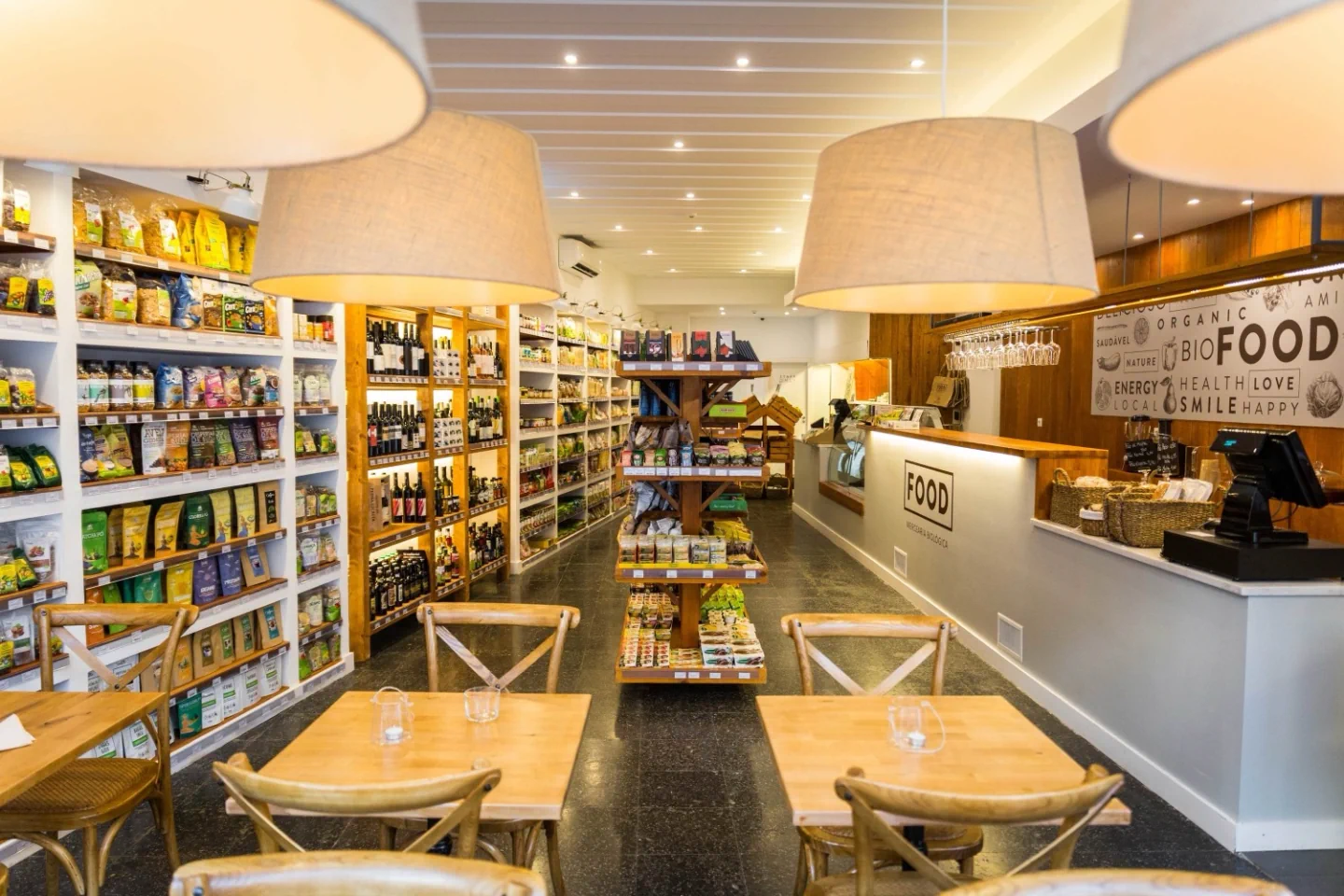 The shelves, counter and café tables at FOOD · Santos