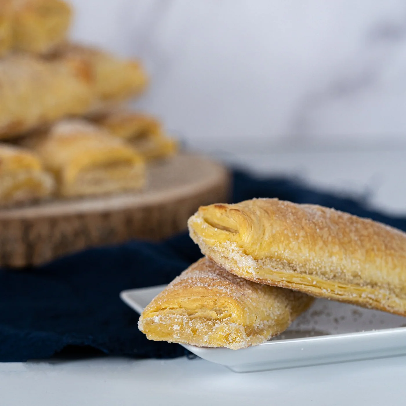 Two sugar-dusted travesseiros in Piriquita’s official pastry gallery