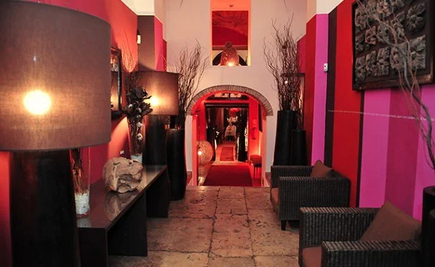 The colourful corridor and seating at Sacramento do Chiado