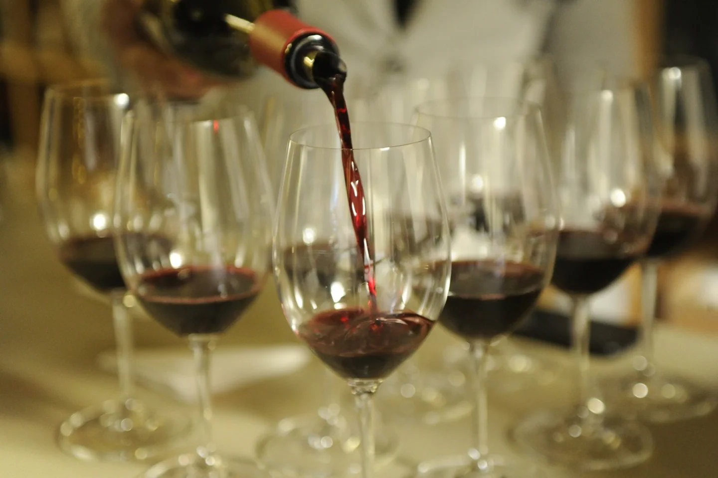 Wine being poured into tasting glasses at Black Sheep
